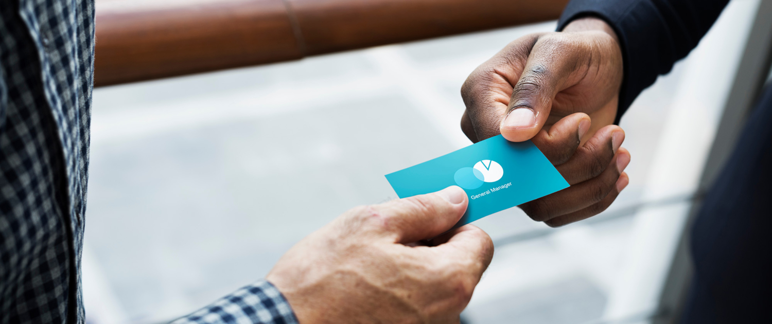 Side View Of Someone Being Handed A Credit Card