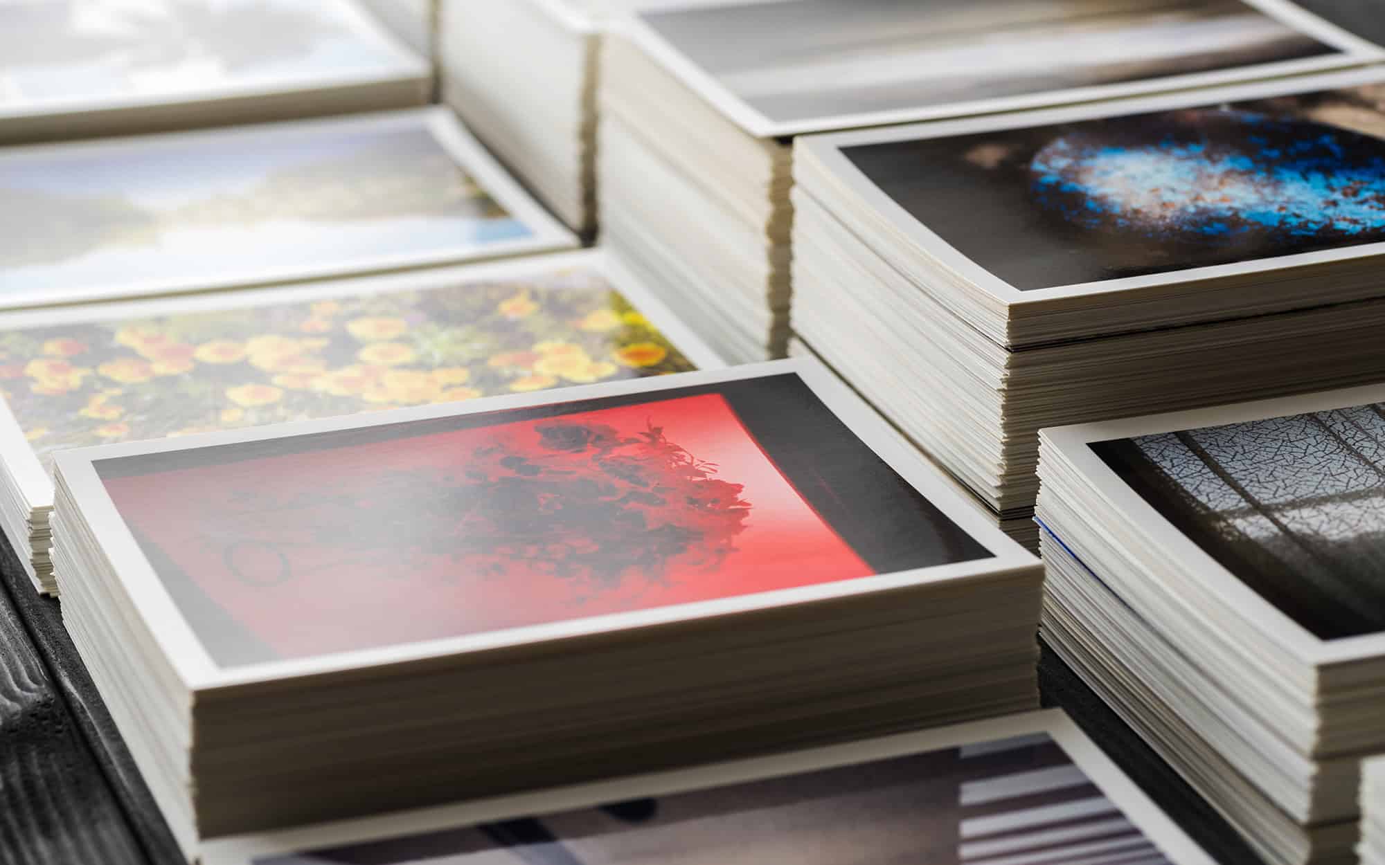 Side View Of Stacks Of Postcards