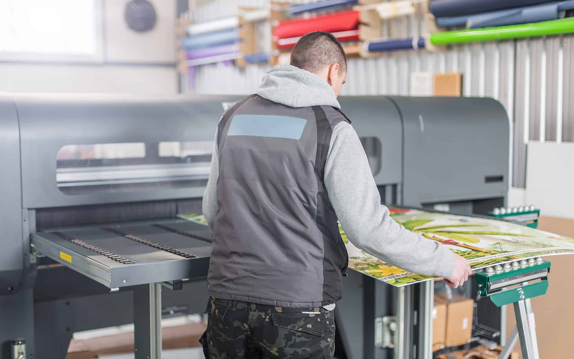 Technician Operator Works On Large Premium Industrial Printer Plotter Machine