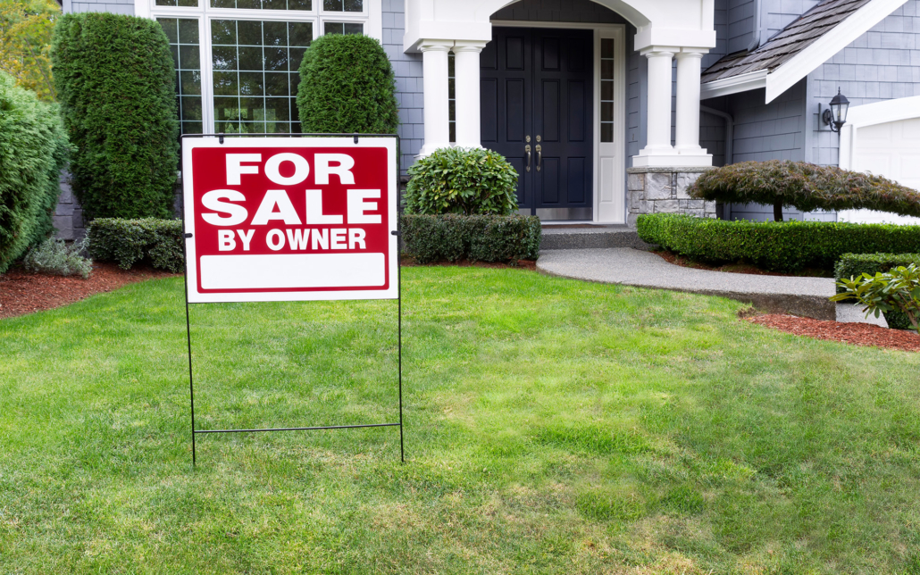 For Sale Yard Sign In Front Lawn