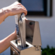 Person Putting Mail In Mailbox