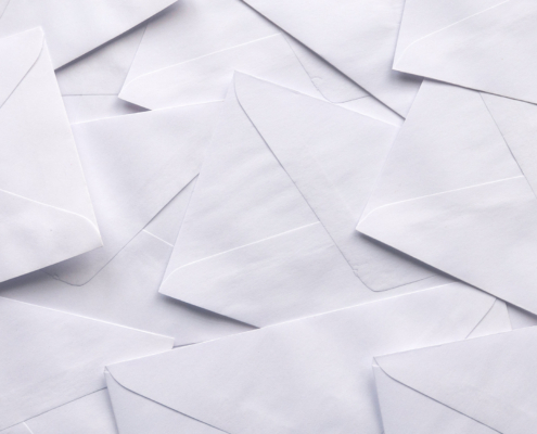A Stack Of White Envelopes For Background