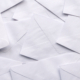 A Stack Of White Envelopes For Background